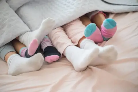 Is It Okay to Sleep With Your Socks On?